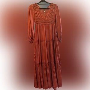 Beautiful woman’s rust colored boho maxi dress